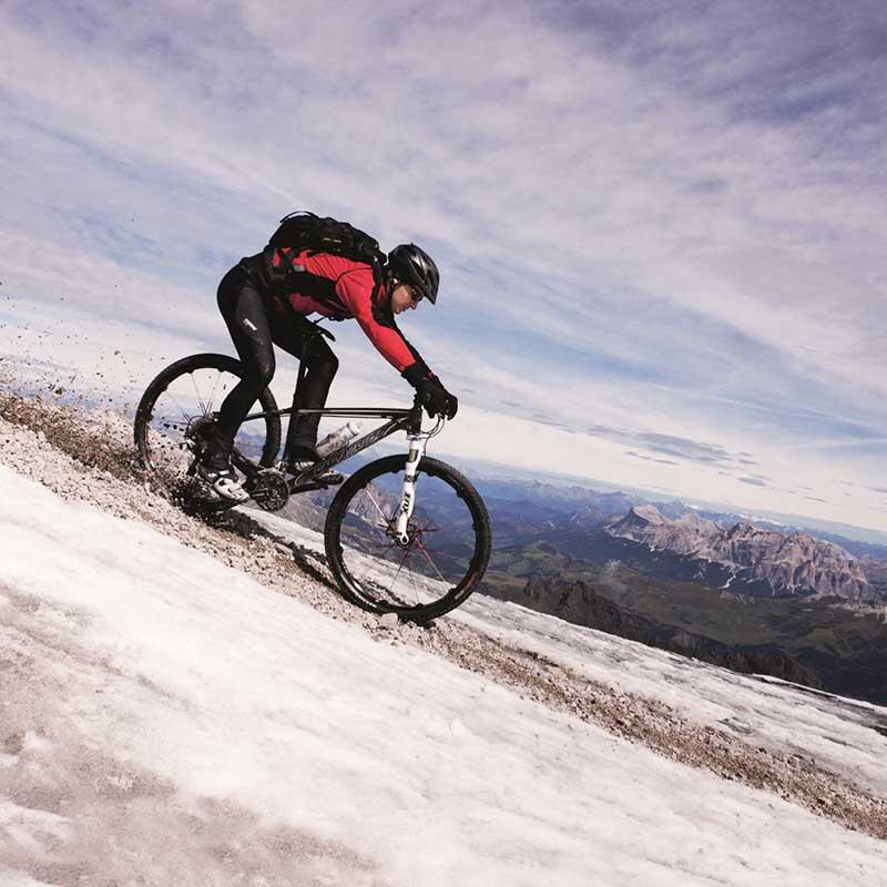 Person mountain biking downhill