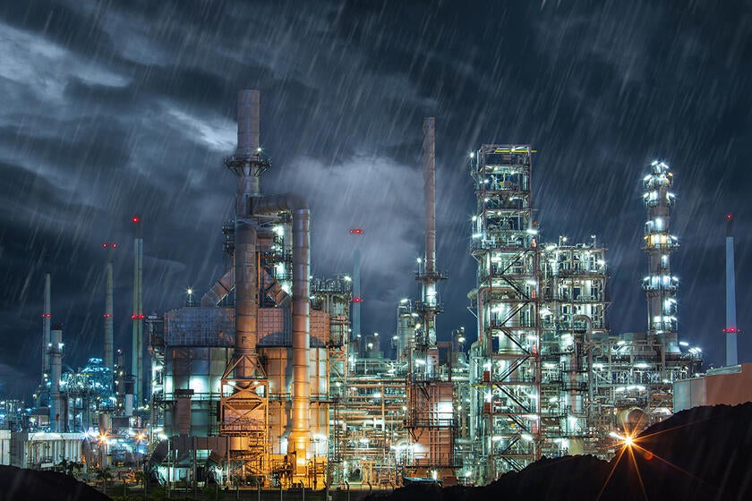 An industrial plant in heavy rain.